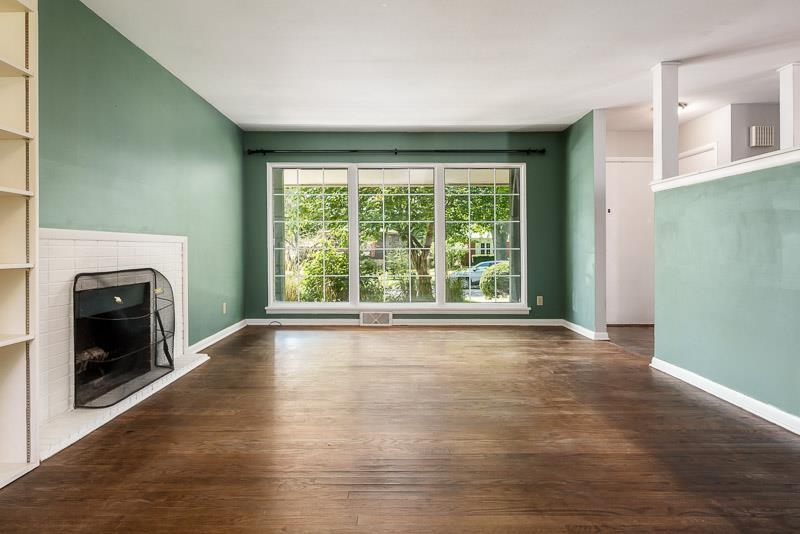 4902 Highcrest Road Rockford, IL 61107 - Photo 10 of 43 a view of an empty room with wooden floor and a window