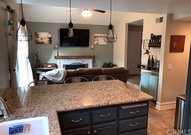 838 Live Oak Place Corona, CA 92882 - Photo 11 of 34 a living room with furniture and a flat screen tv
