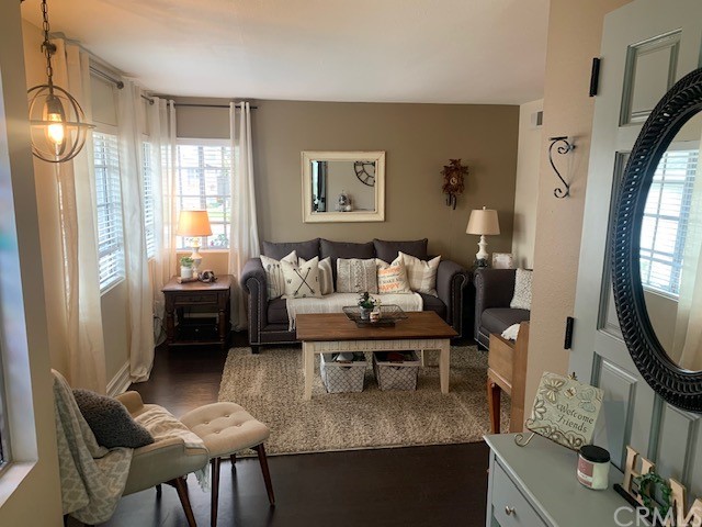 838 Live Oak Place Corona, CA 92882 - Photo 12 of 34 a living room with furniture and a mirror