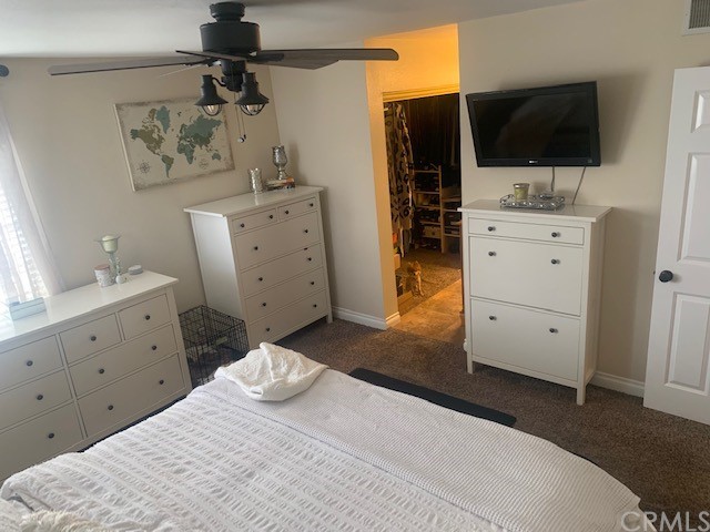 838 Live Oak Place Corona, CA 92882 - Photo 19 of 34 a bedroom with a bed and flat screen tv