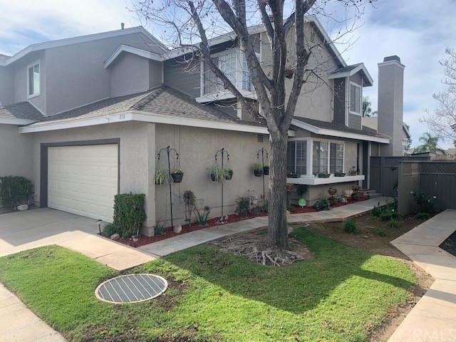 838 Live Oak Place Corona, CA 92882 - Photo 2 of 34 a front view of a house with garden