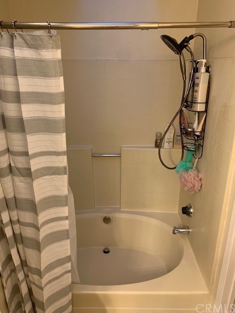 838 Live Oak Place Corona, CA 92882 - Photo 22 of 34 a bathroom with a shower and a shower head