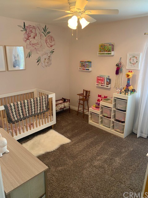838 Live Oak Place Corona, CA 92882 - Photo 27 of 34 a living room with furniture and a baby crib