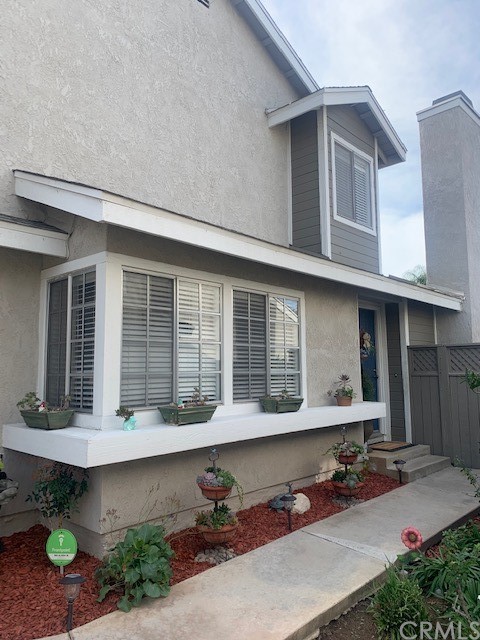 838 Live Oak Place Corona, CA 92882 - Photo 3 of 34 a front view of a house with seating area