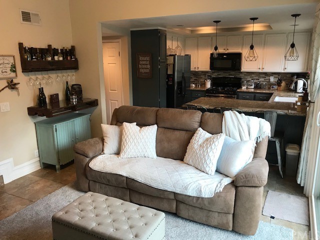 838 Live Oak Place Corona, CA 92882 - Photo 8 of 34 a living room with furniture and a wooden floor