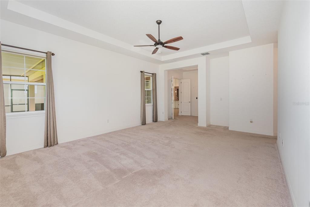 4911 Drawdy Court St. Cloud, FL 34772 - Photo 11 of 37 a view of a livingroom with a ceiling fan and window