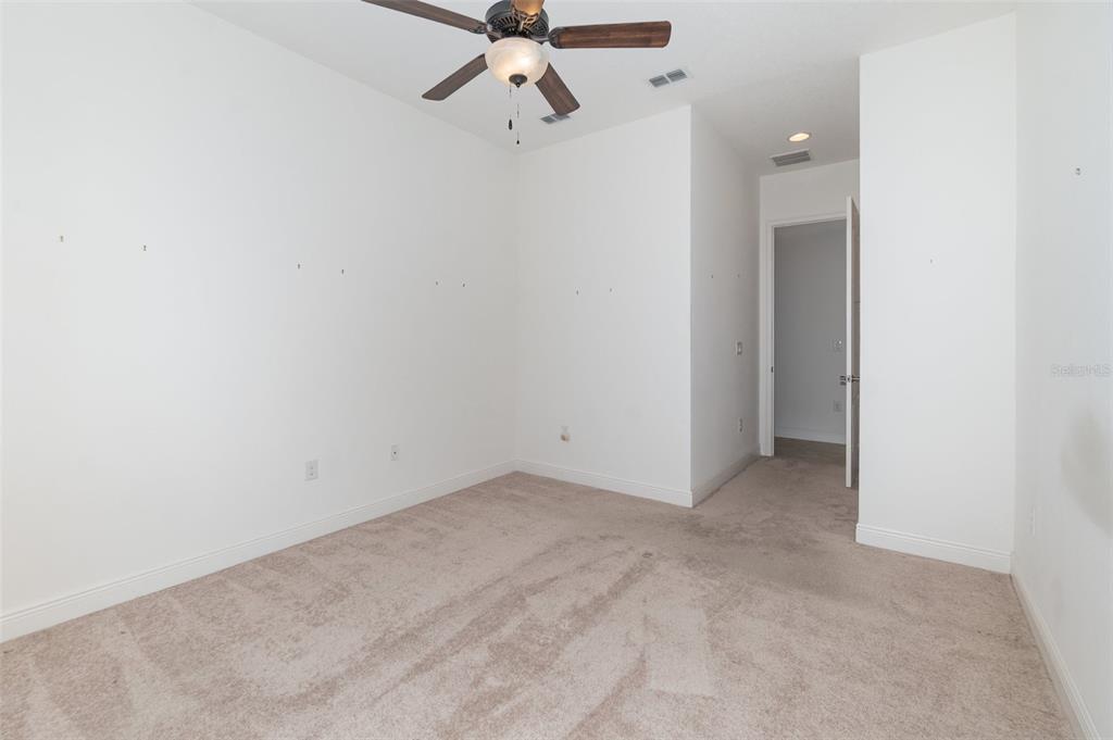 4911 Drawdy Court St. Cloud, FL 34772 - Photo 22 of 37 a view of a room with a fan
