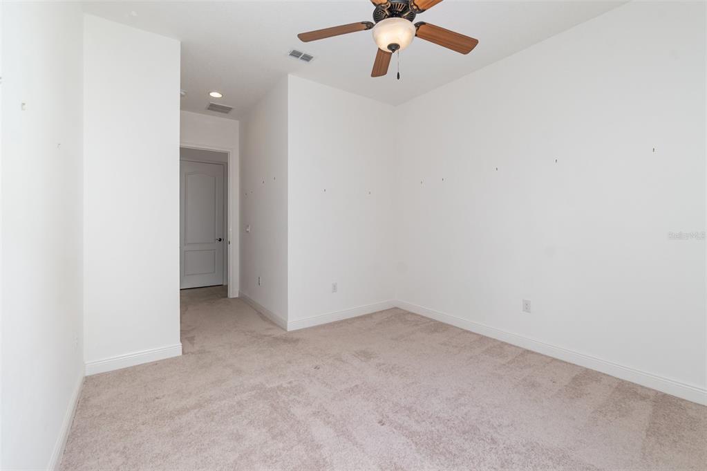 4911 Drawdy Court St. Cloud, FL 34772 - Photo 24 of 37 an empty room with a fan & a window