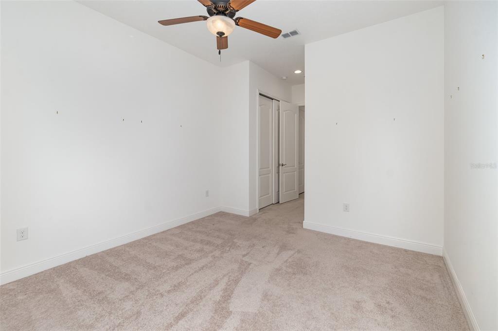 4911 Drawdy Court St. Cloud, FL 34772 - Photo 25 of 37 an empty room with a fan & a window