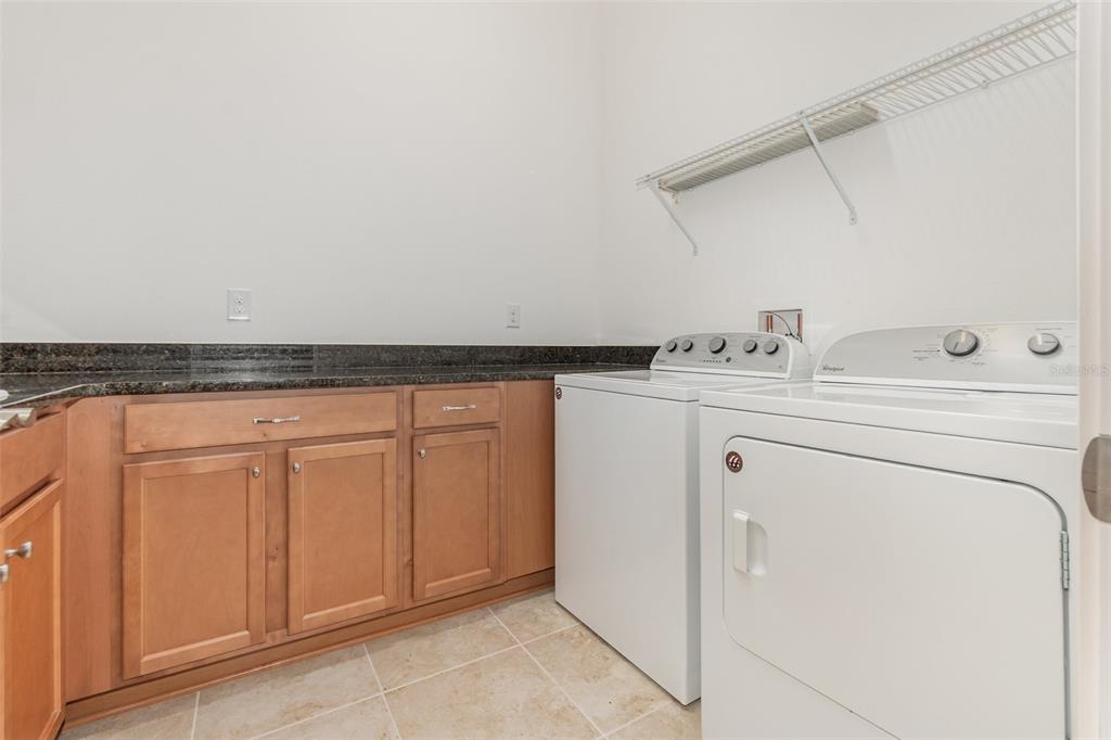 4911 Drawdy Court St. Cloud, FL 34772 - Photo 28 of 37 a utility room with dryer and washer