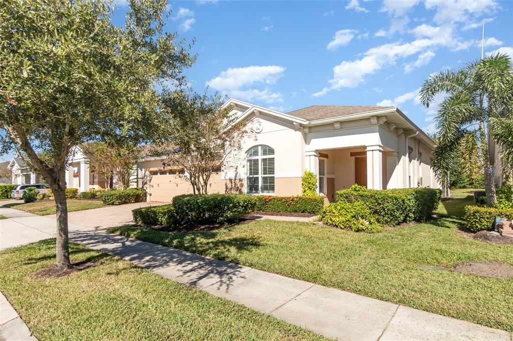 4911 Drawdy Court St. Cloud, FL 34772 - Photo 3 of 37 a front view of a house with a yard