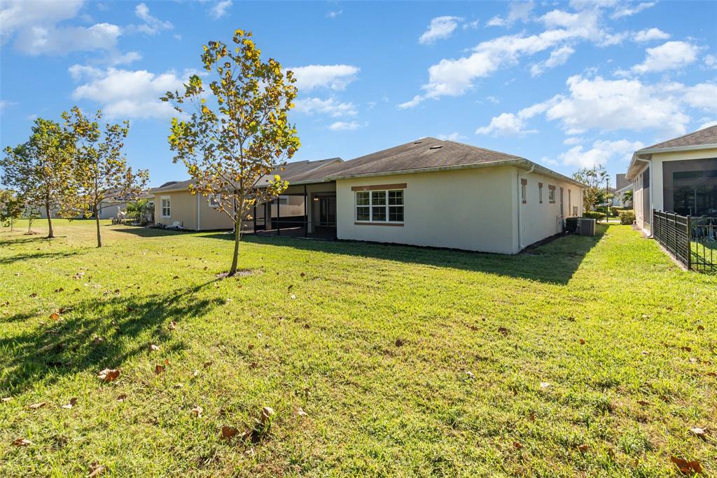 4911 Drawdy Court St. Cloud, FL 34772 - Photo 37 of 37 a view of a house with a yard