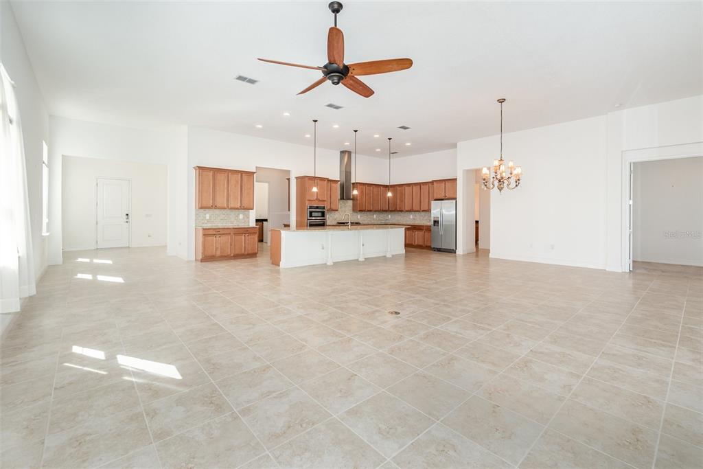 4911 Drawdy Court St. Cloud, FL 34772 - Photo 4 of 37 a view of a kitchen and a stove cabinets