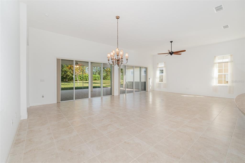 4911 Drawdy Court St. Cloud, FL 34772 - Photo 9 of 37 a view of a room with window and chandelier