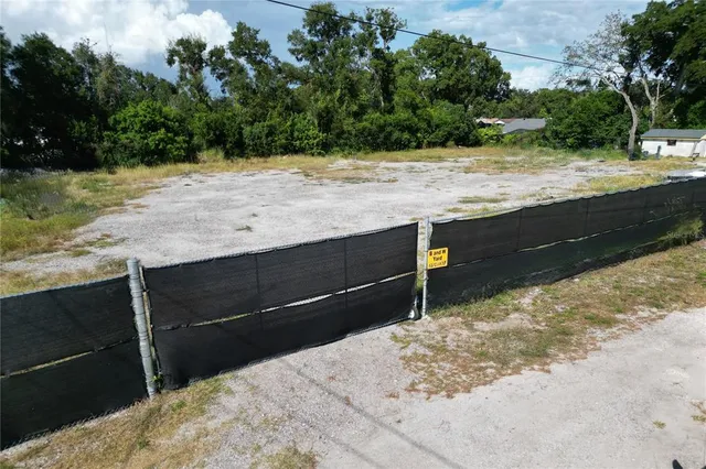 a view of a backyard of the house