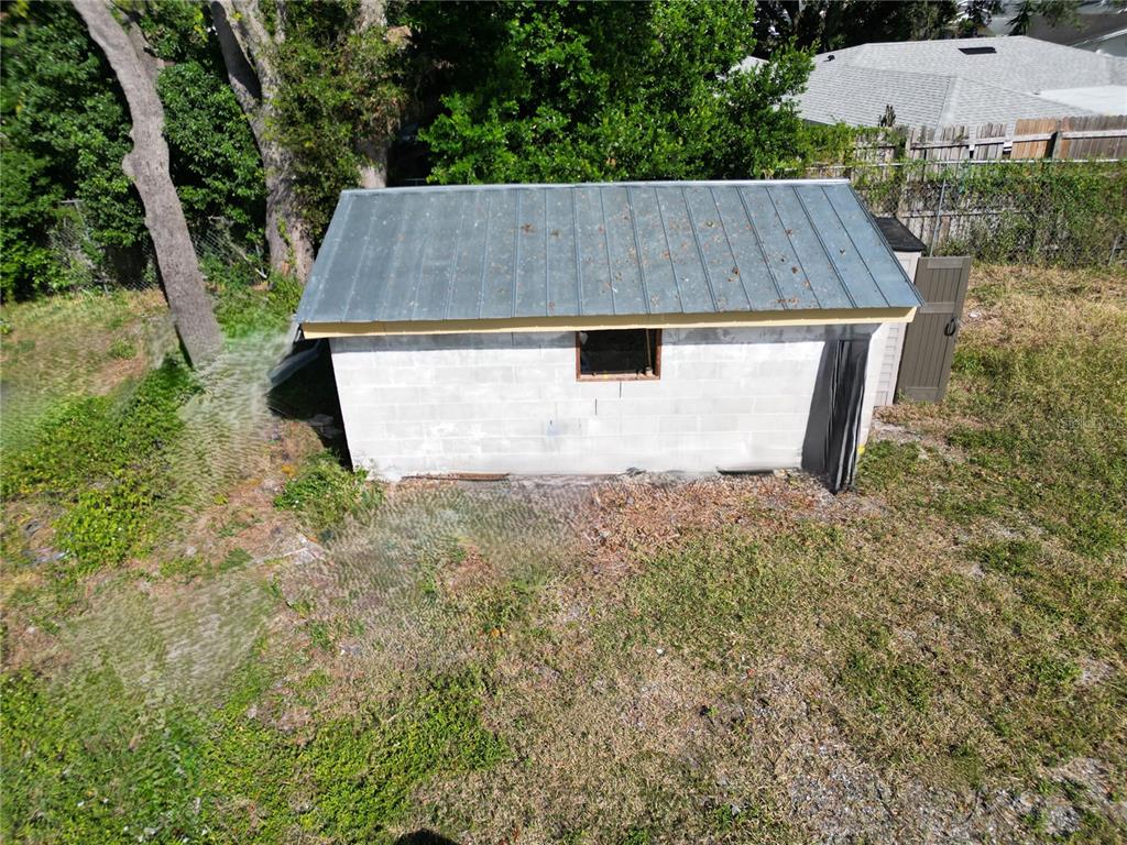 4155 Pine Haven Road New Port Richey, FL 34653 - Photo 8 of 12 an aerial view of a house having yard