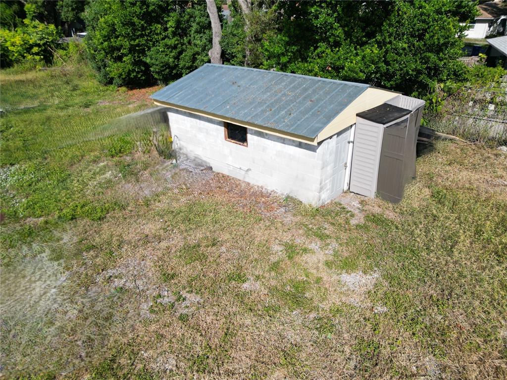 4155 Pine Haven Road New Port Richey, FL 34653 - Photo 9 of 12 a house with green field in front of it