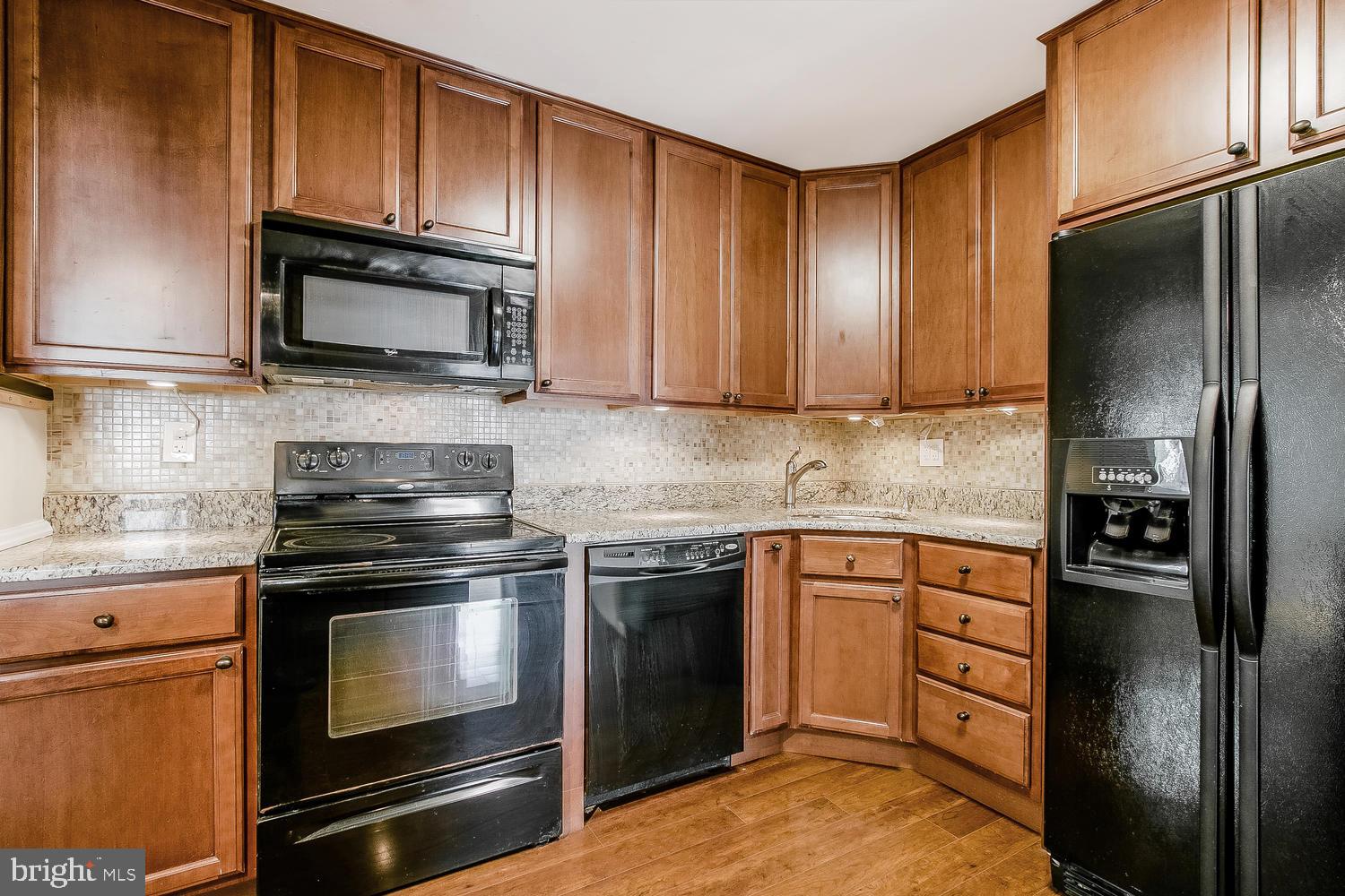 1108 Faun Road Wilmington, DE 19803 - Photo 10 of 27 Sleek black appliances & under cabinet lighting