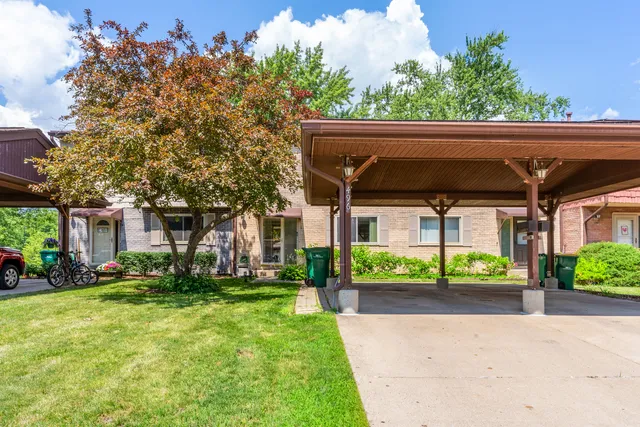 front view of a house with a yard