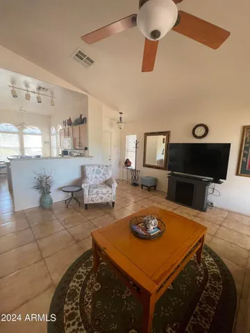 a kitchen with a sink a stove and chairs