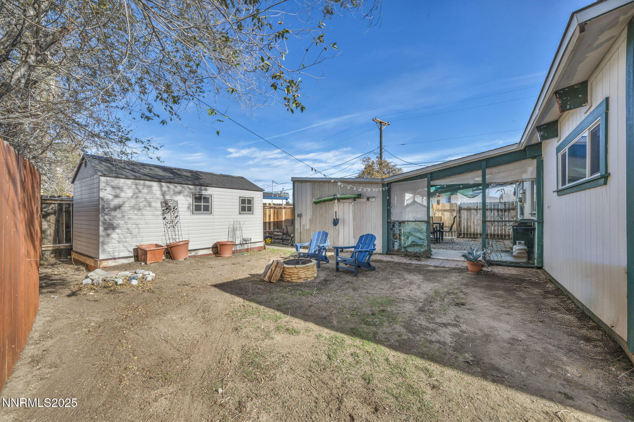 13623 Mt Baldy Street Reno, NV 89506 - Photo 11 of 46 a view of a dining room with furniture large windows and wooden floor