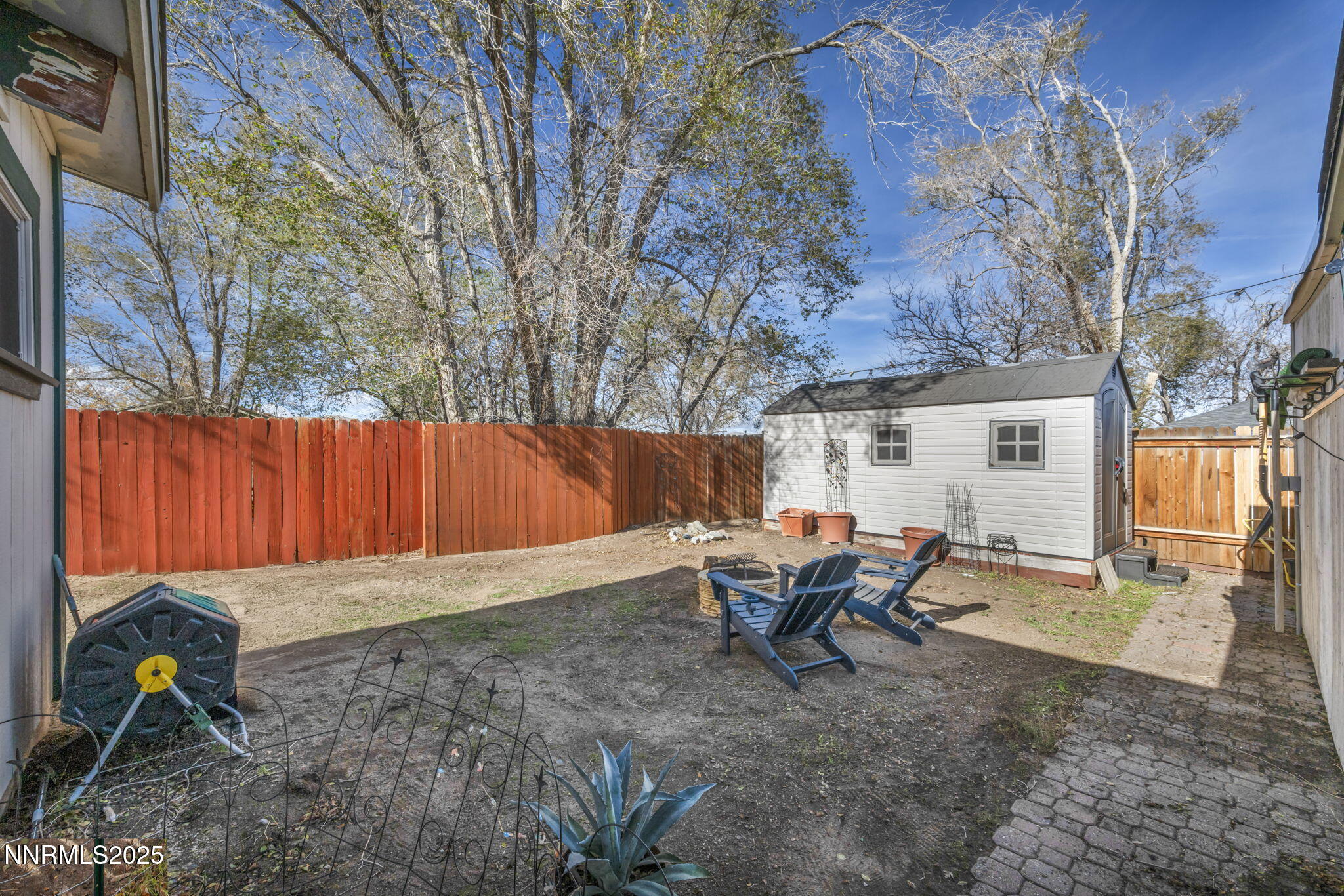 13623 Mt Baldy Street Reno, NV 89506 - Photo 12 of 46 a view of a backyard with table and chairs and a fire pit
