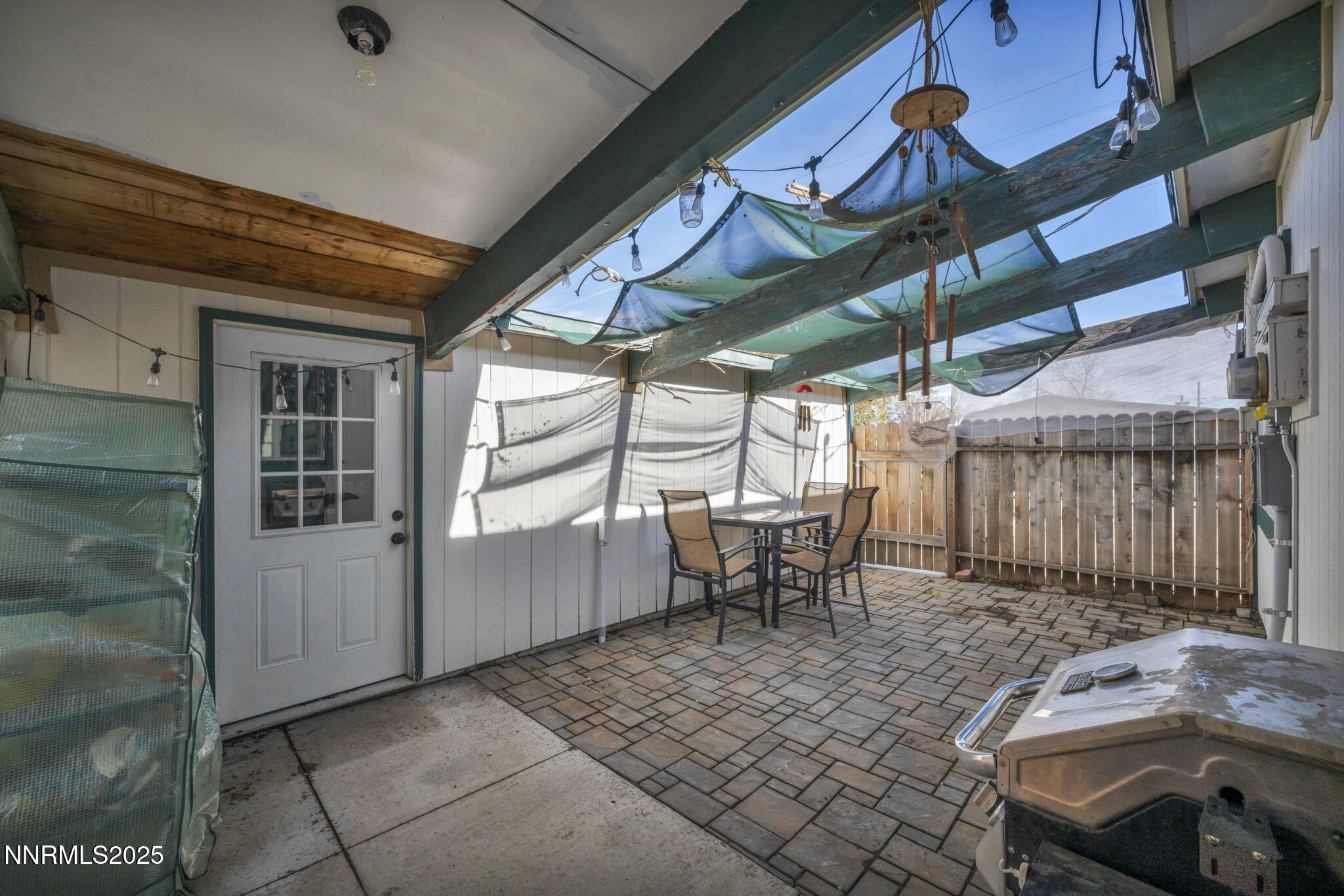 13623 Mt Baldy Street Reno, NV 89506 - Photo 17 of 46 a view of a backyard with table and chairs with wooden floor