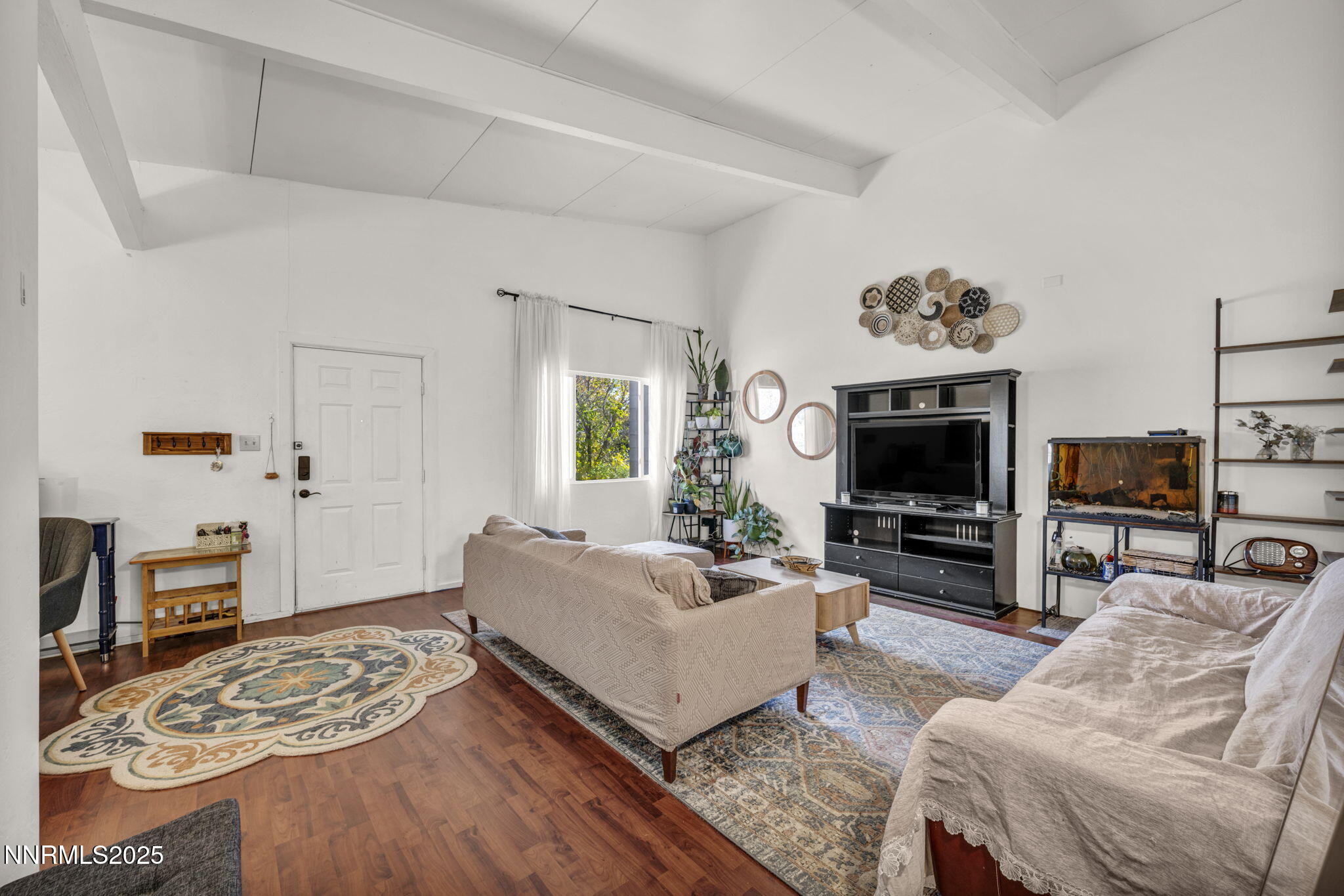 13623 Mt Baldy Street Reno, NV 89506 - Photo 20 of 46 a living room with furniture a flat screen tv and a fireplace