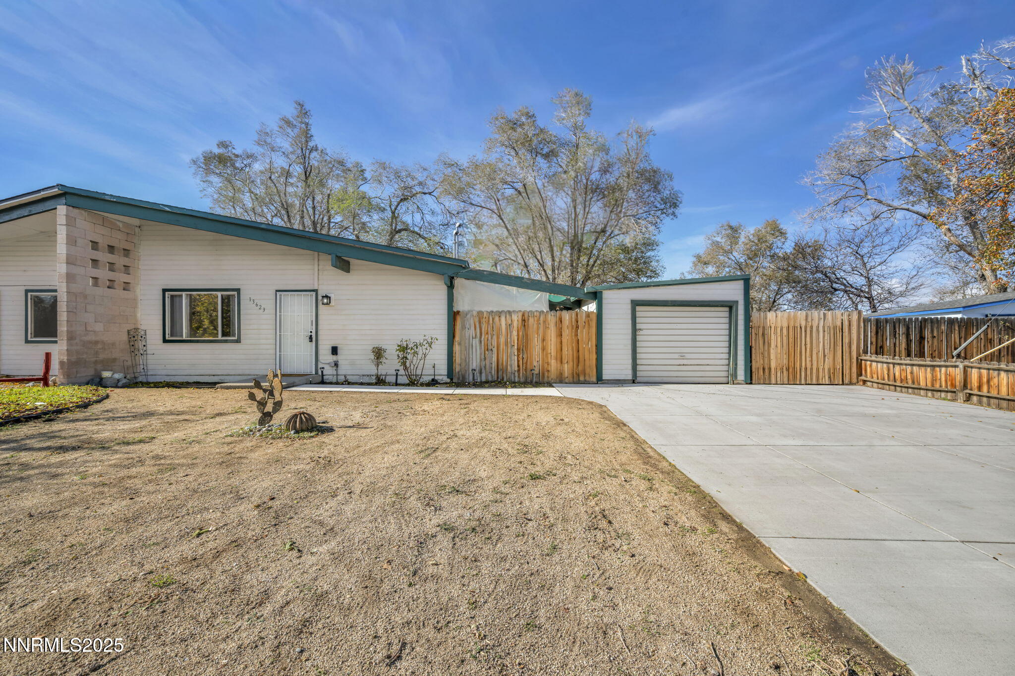 13623 Mt Baldy Street Reno, NV 89506 - Photo 2 of 46 a view of a house with a yard and garage