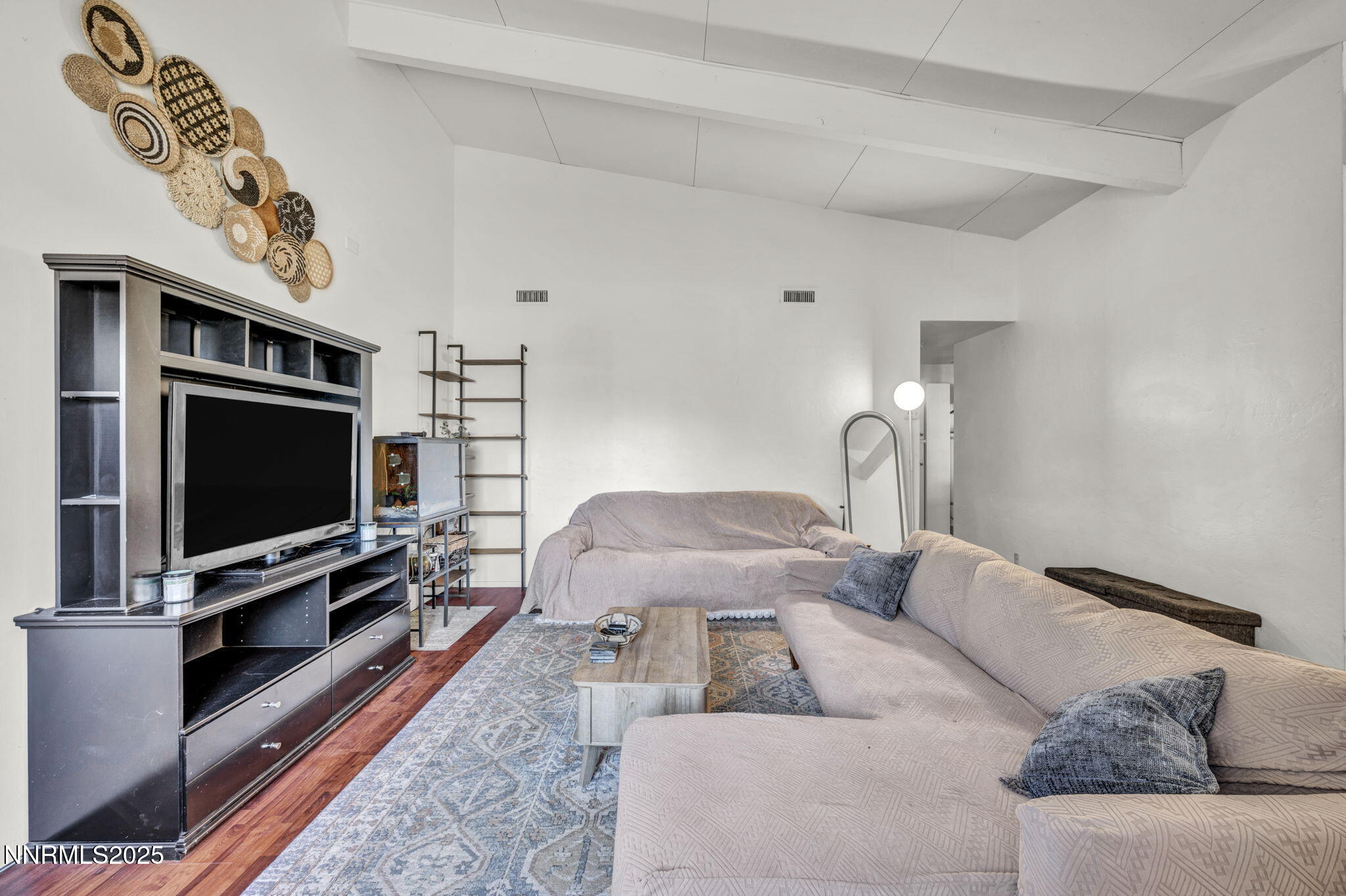 13623 Mt Baldy Street Reno, NV 89506 - Photo 27 of 46 a living room with a flat screen tv and a couch