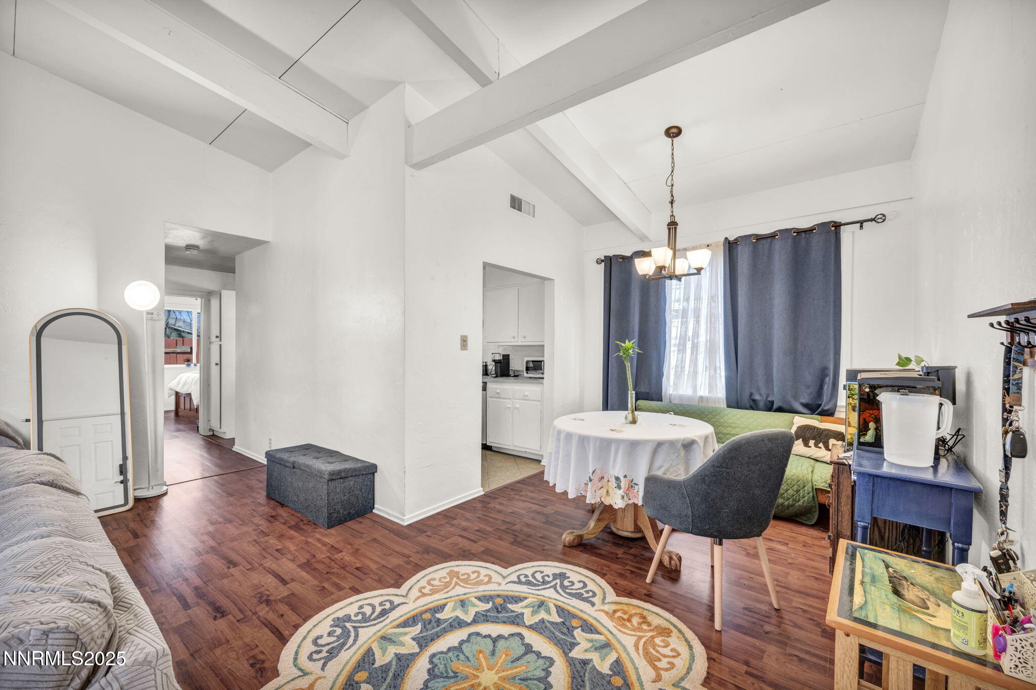 13623 Mt Baldy Street Reno, NV 89506 - Photo 28 of 46 a living room with furniture a dining table and a large window
