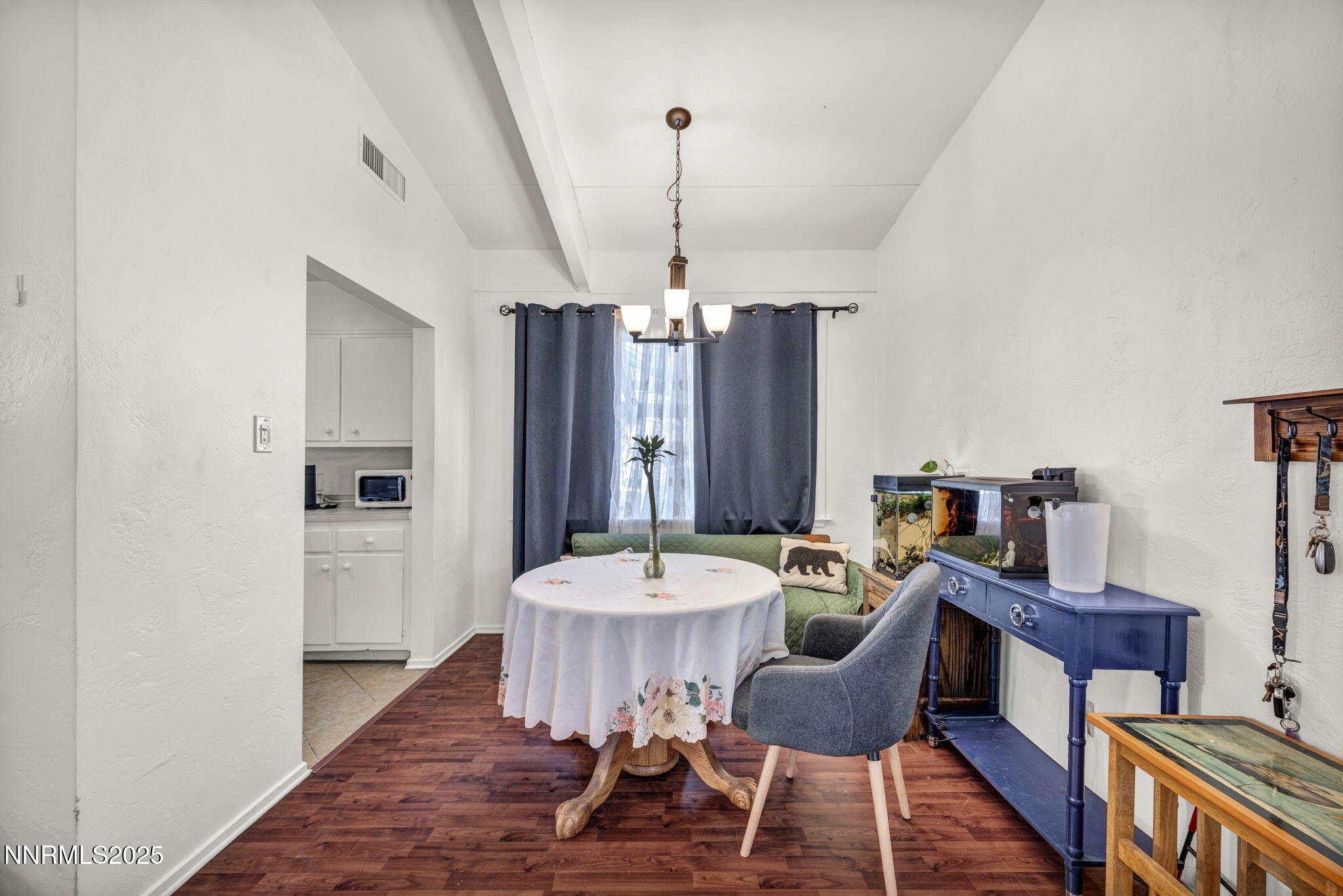 13623 Mt Baldy Street Reno, NV 89506 - Photo 30 of 46 a view of a dining room with furniture window and wooden floor