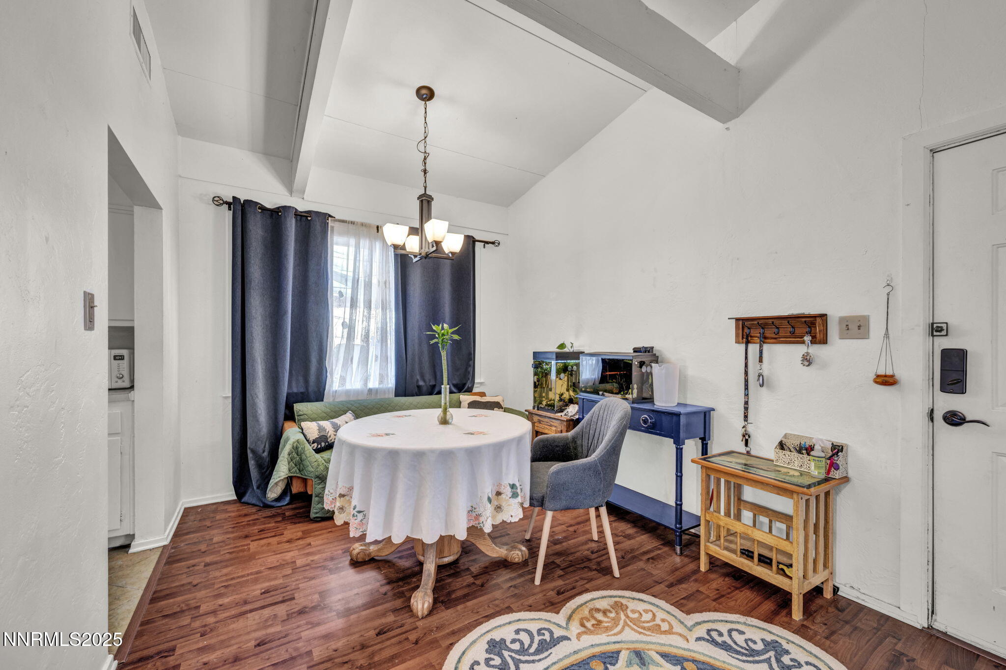 13623 Mt Baldy Street Reno, NV 89506 - Photo 31 of 46 a view of a dining room with furniture window and wooden floor
