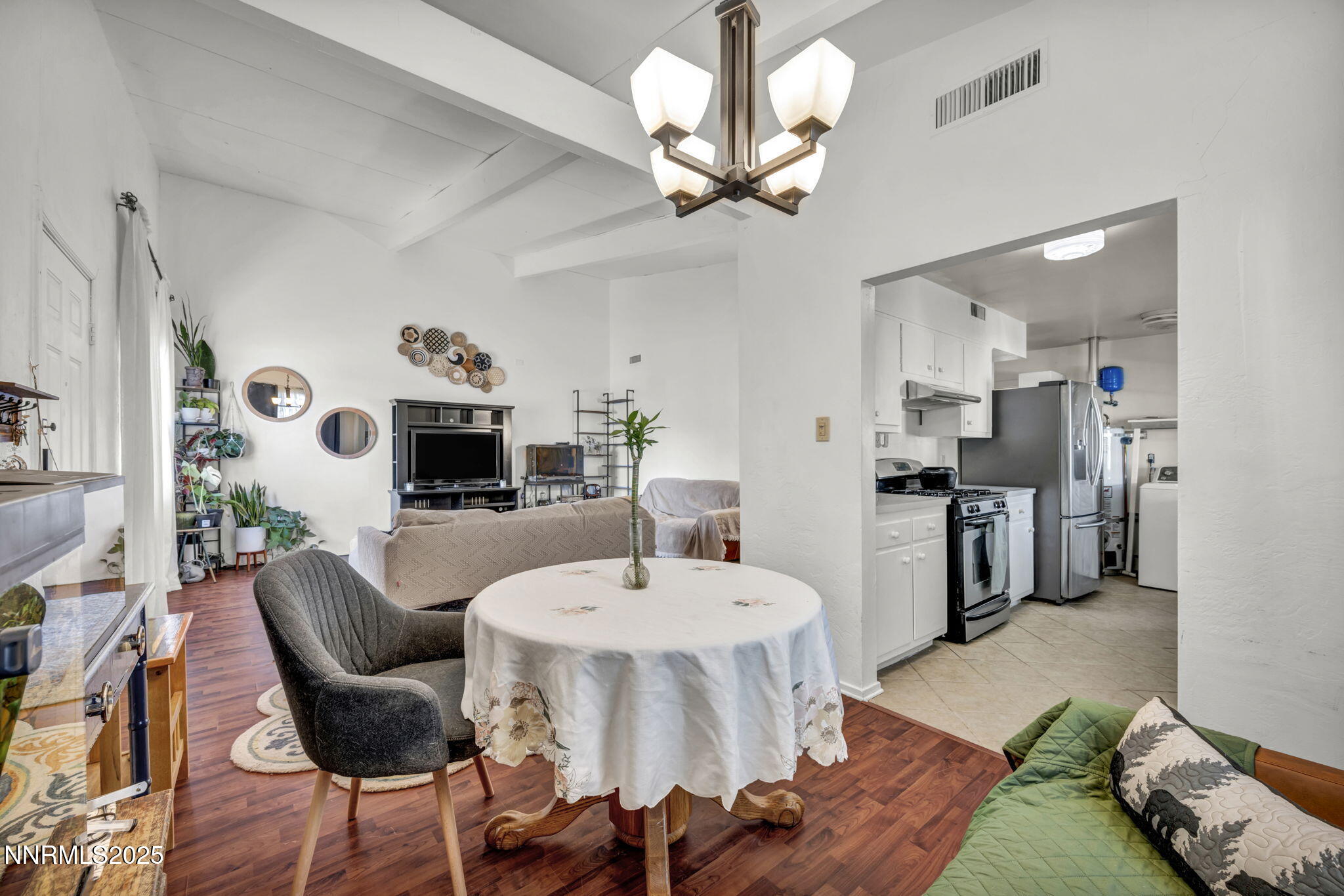13623 Mt Baldy Street Reno, NV 89506 - Photo 33 of 46 a living room with furniture and a dining table with kitchen view