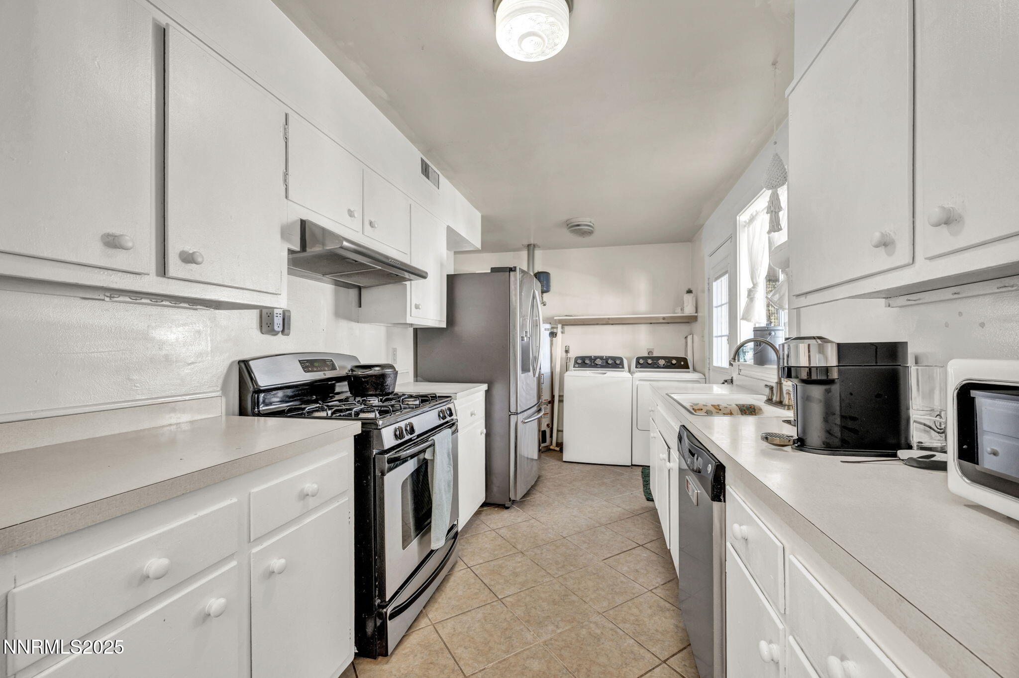 13623 Mt Baldy Street Reno, NV 89506 - Photo 36 of 46 a kitchen with a sink dishwasher stove and refrigerator
