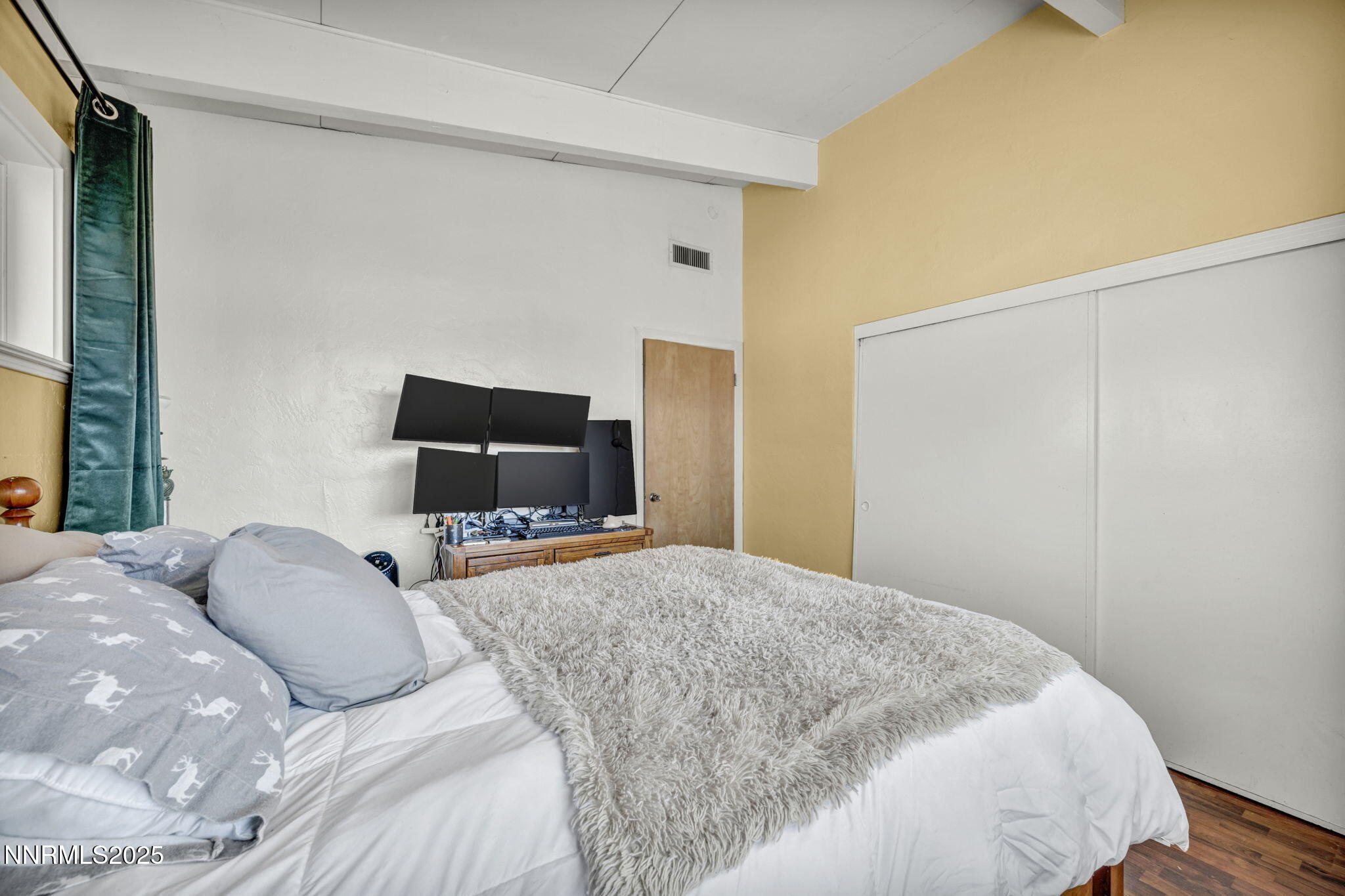 13623 Mt Baldy Street Reno, NV 89506 - Photo 41 of 46 a bedroom with a bed and flat screen tv