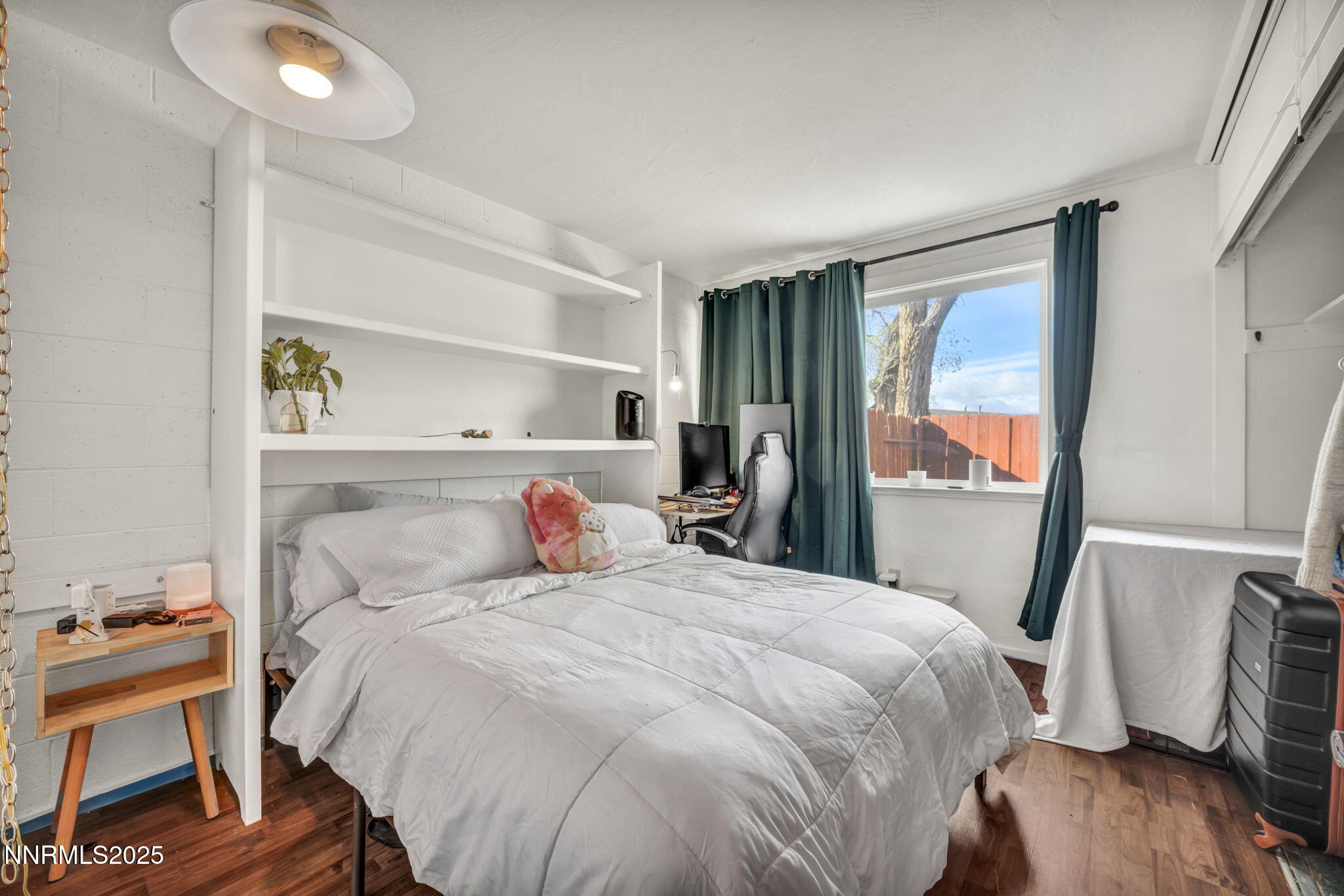 13623 Mt Baldy Street Reno, NV 89506 - Photo 42 of 46 a bedroom with a bed and wooden floor