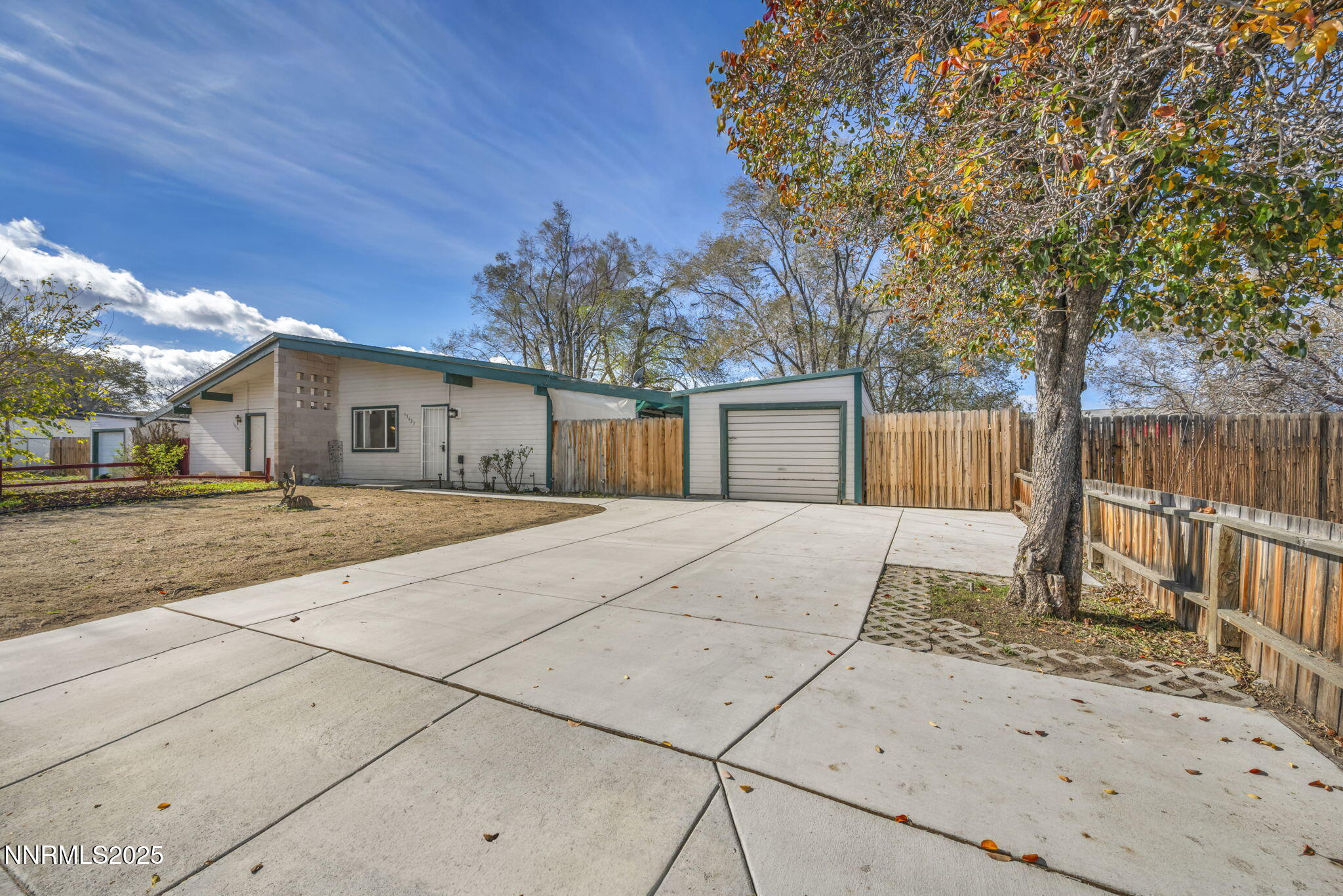 13623 Mt Baldy Street Reno, NV 89506 - Photo 5 of 46 a front view of a house with a garden
