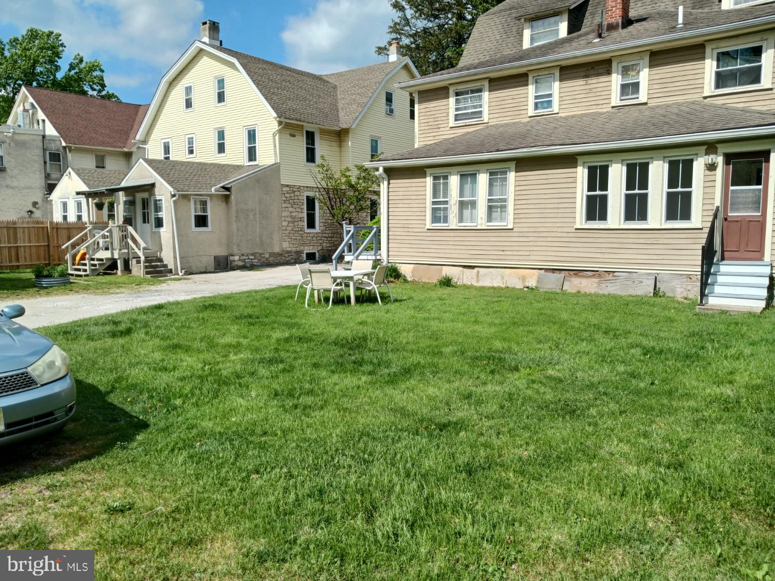 58 Darby Road, Unit 1 Paoli, PA 19301 - Photo 12 of 15 a front view of a house with a garden and trees