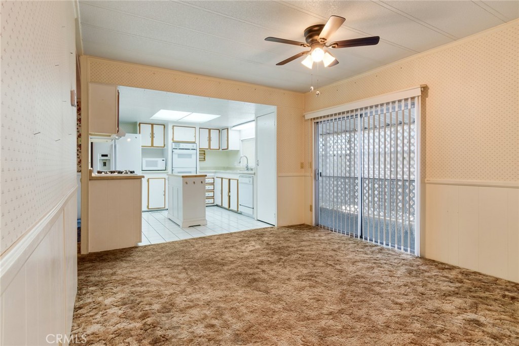 3500 Buchanan Street, Unit 73 Riverside, CA 92503 - Photo 11 of 30 a view of a kitchen with furniture and wooden floor