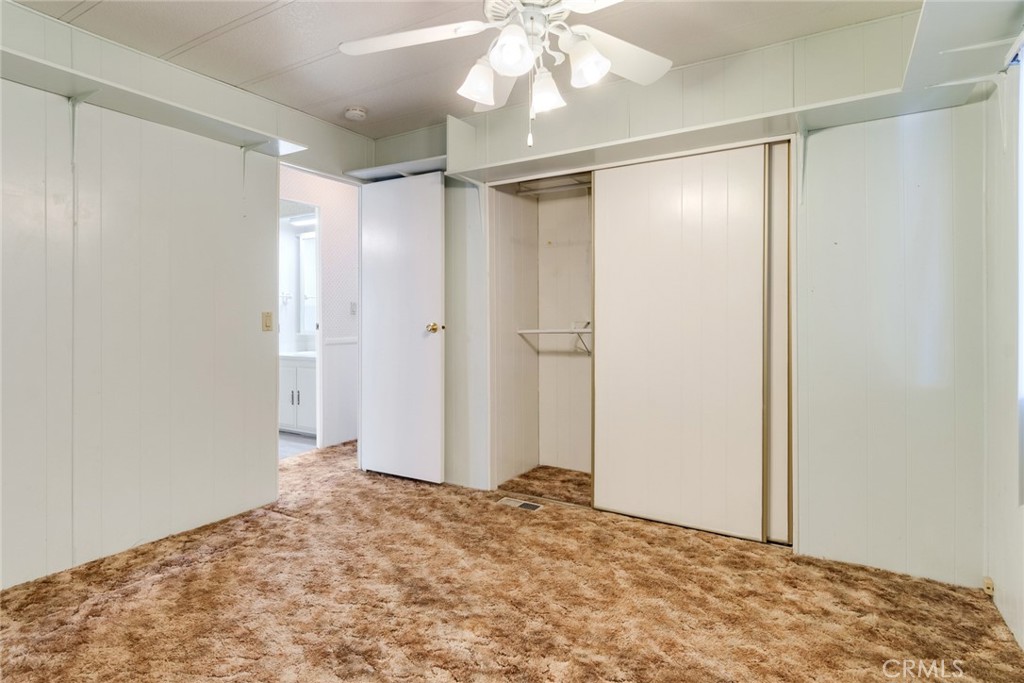 3500 Buchanan Street, Unit 73 Riverside, CA 92503 - Photo 13 of 30 a view of a big room with a chandelier fan and closet