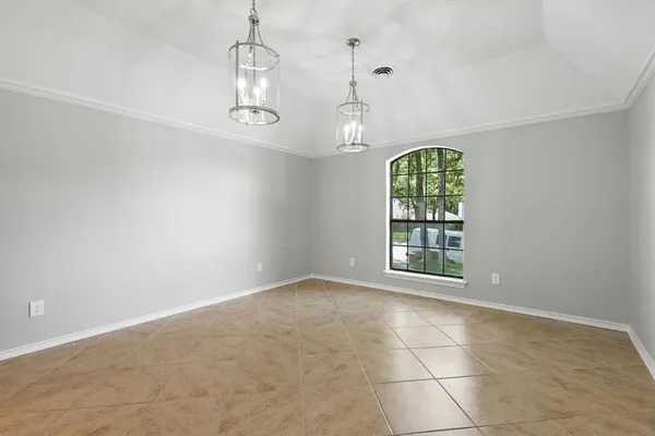 a kitchen with granite countertop cabinets and utility