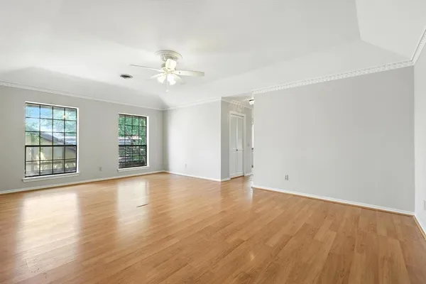 a bedroom with a bed and a night stand