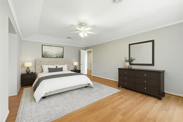 a spacious bathroom with a granite countertop sink and a mirror