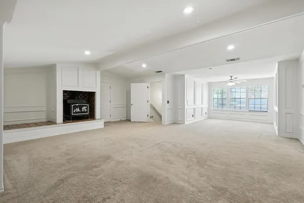 a bathroom with a sink double vanity granite tub and a mirror