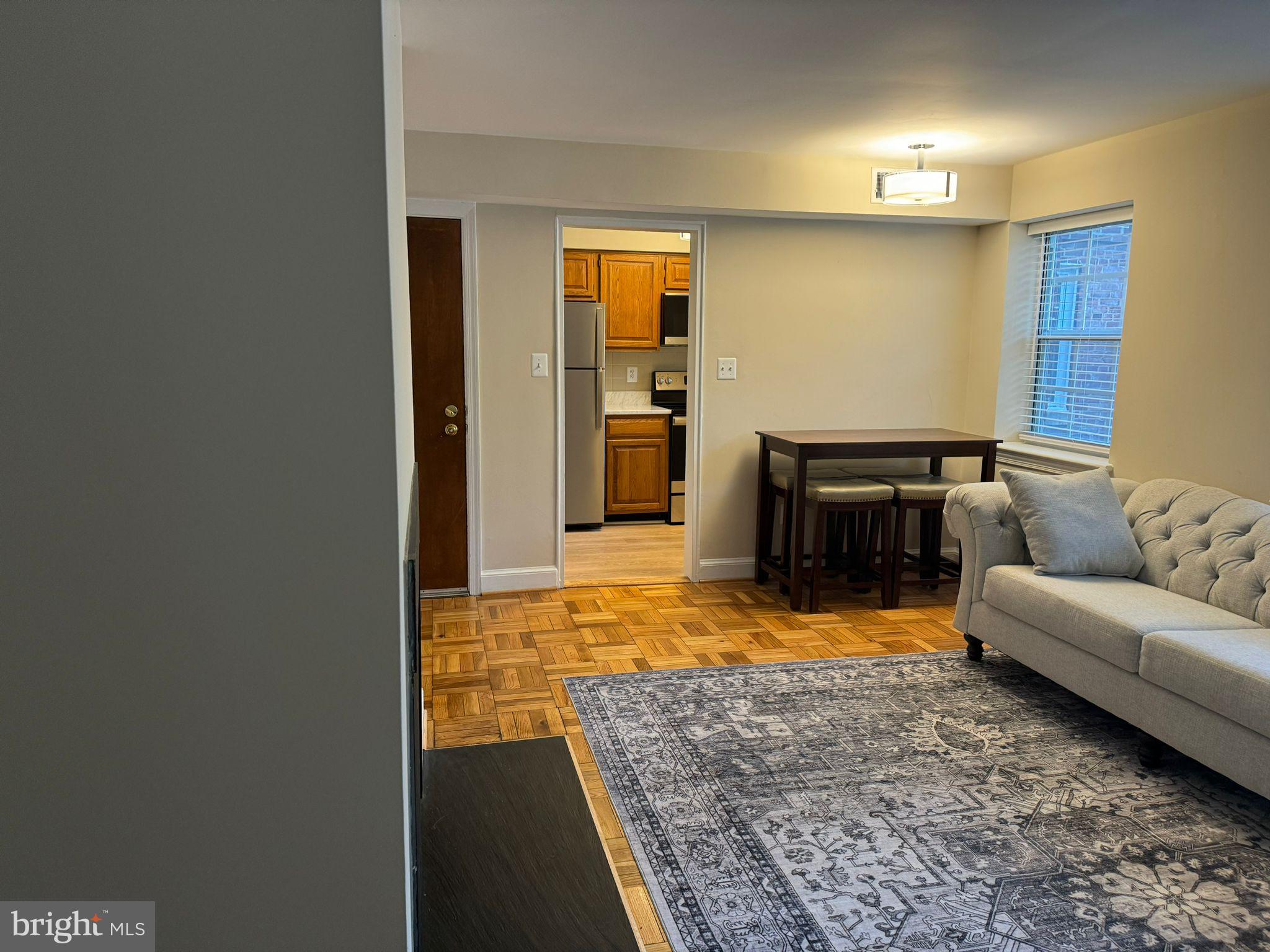2107 North Scott Street, Unit 67 Arlington, VA 22209 - Photo 11 of 16 a view of a livingroom with furniture and a couch