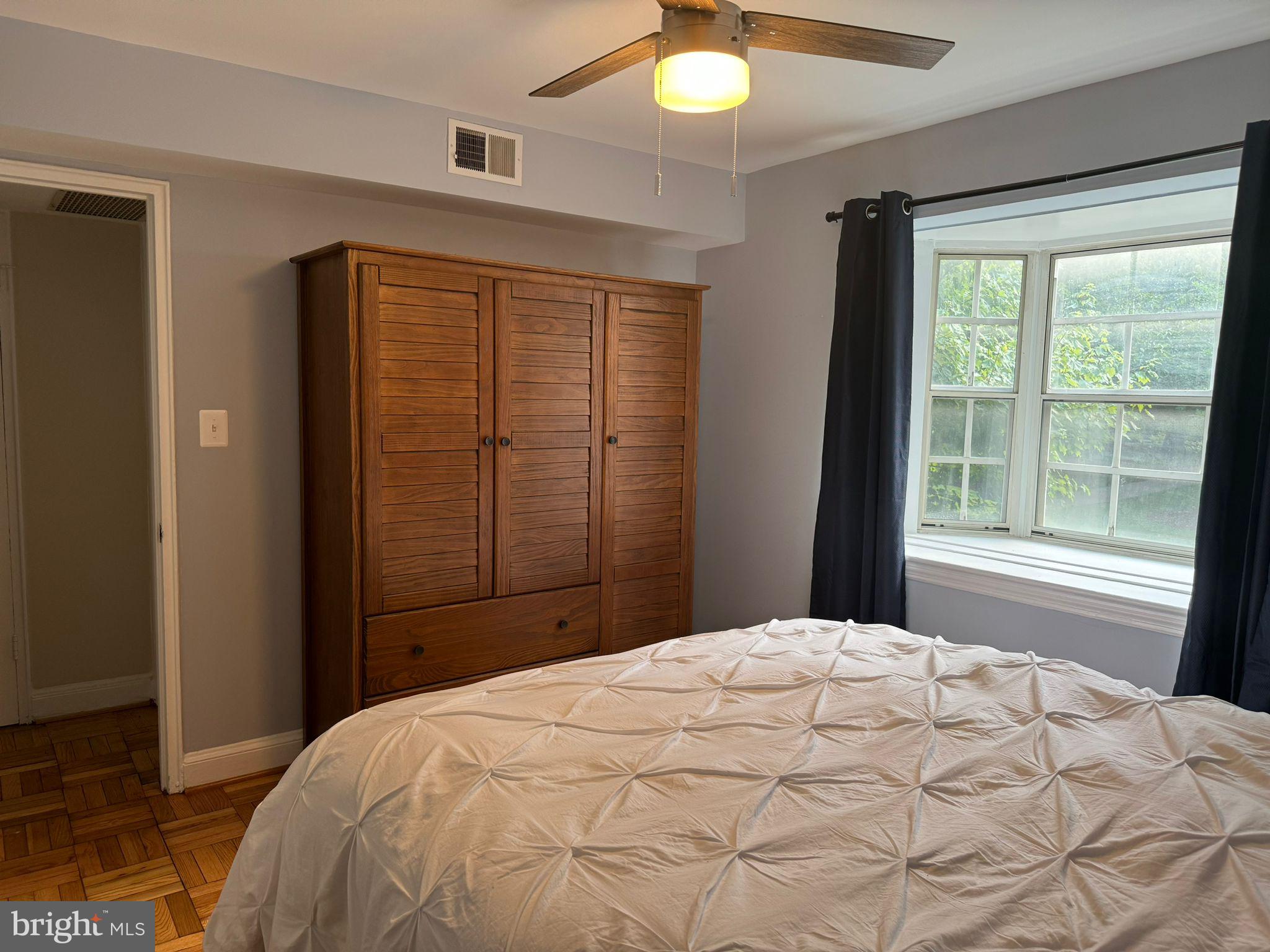 2107 North Scott Street, Unit 67 Arlington, VA 22209 - Photo 12 of 16 a bedroom with a bed and a window