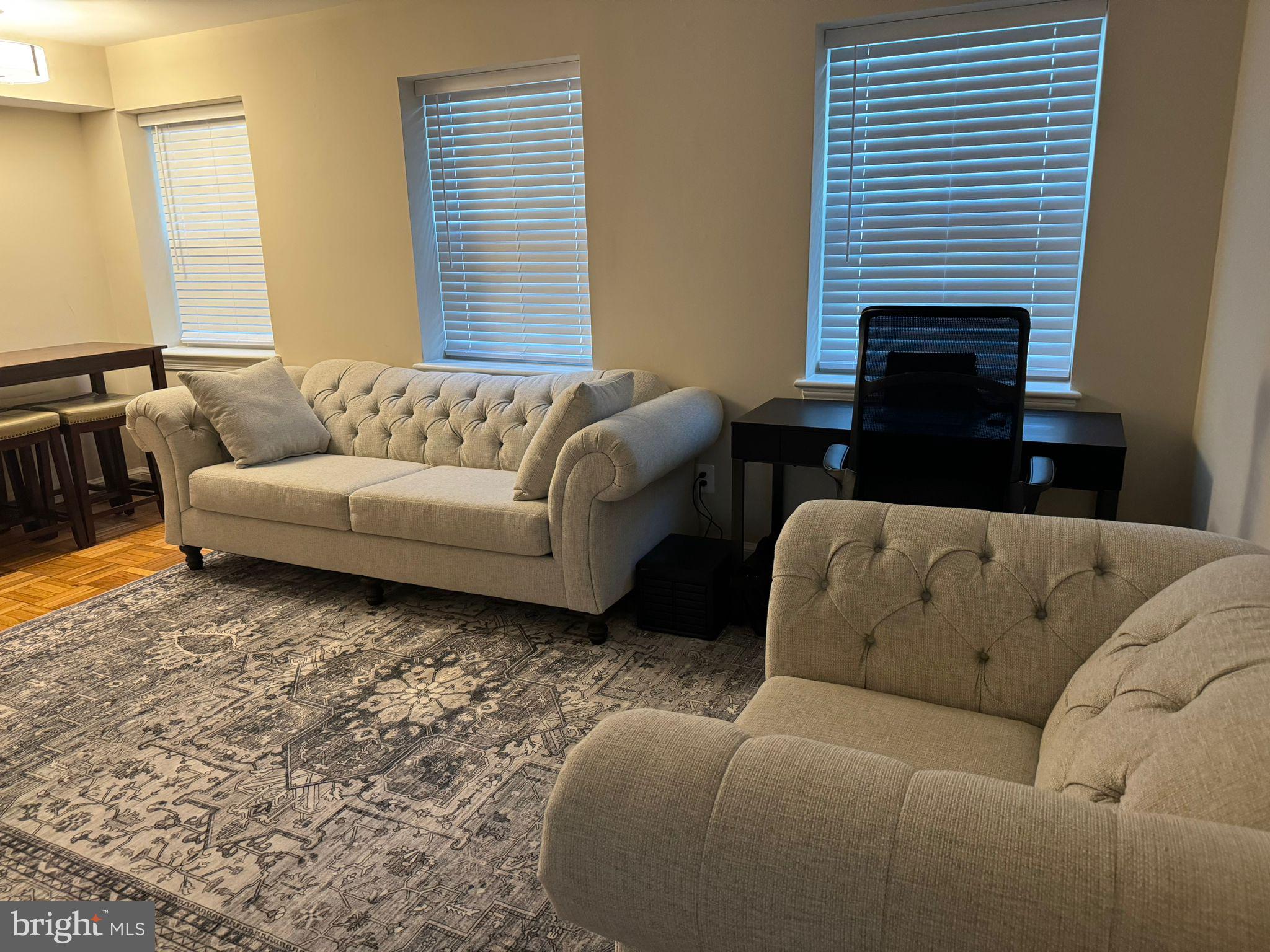 2107 North Scott Street, Unit 67 Arlington, VA 22209 - Photo 13 of 16 a living room with furniture and a fireplace