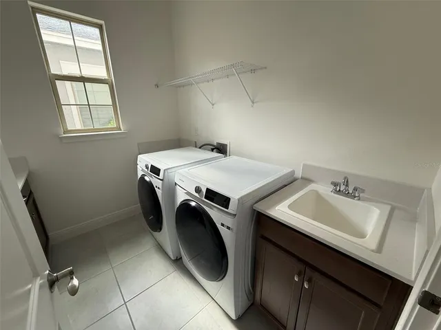 a bathroom with a double vanity sink and mirror