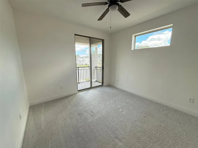 a spacious bathroom with a granite countertop sink a mirror and a